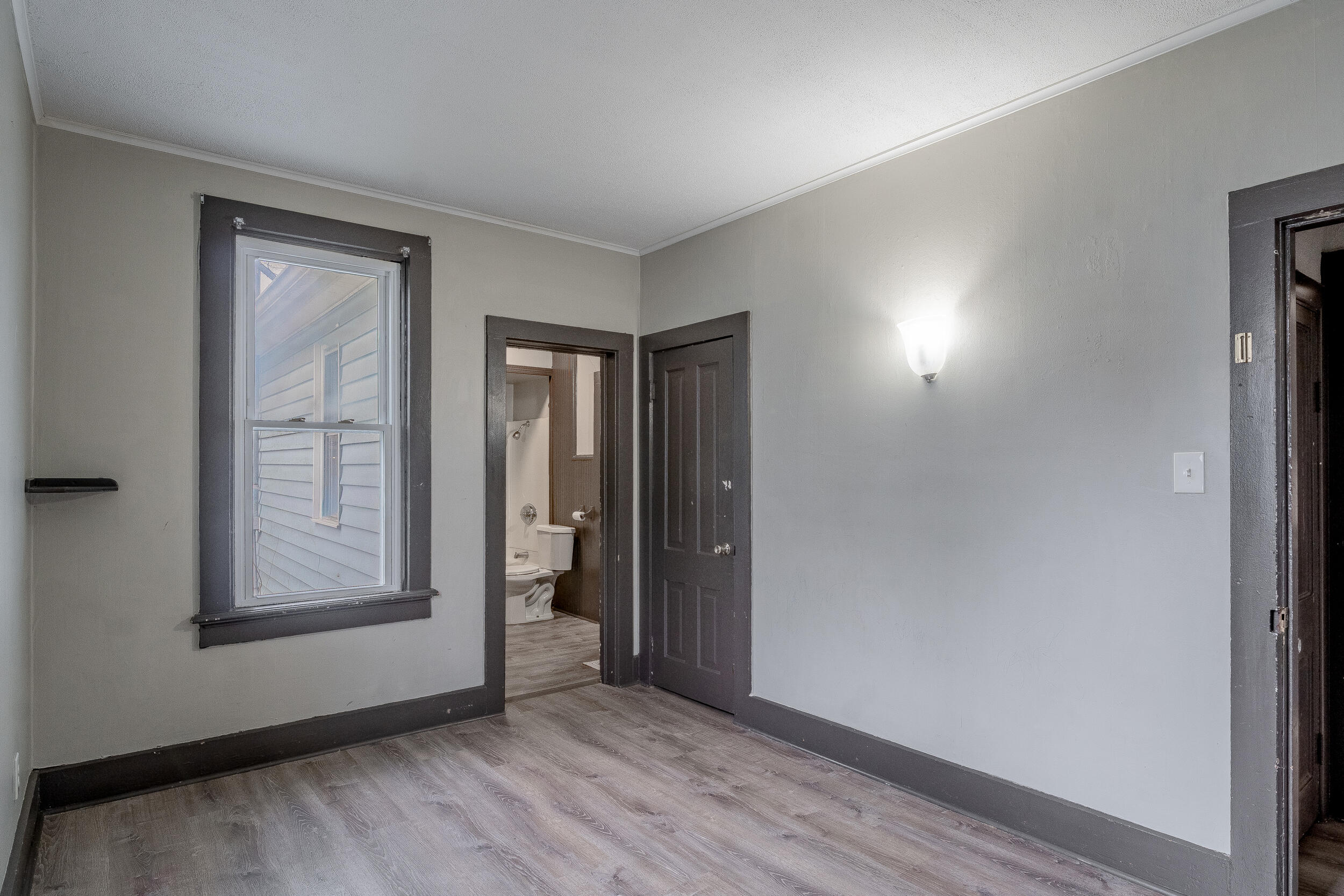 403 Rose Street La Porte, IN 46350 - Photo 15 of 28 an empty room with wooden floor and windows