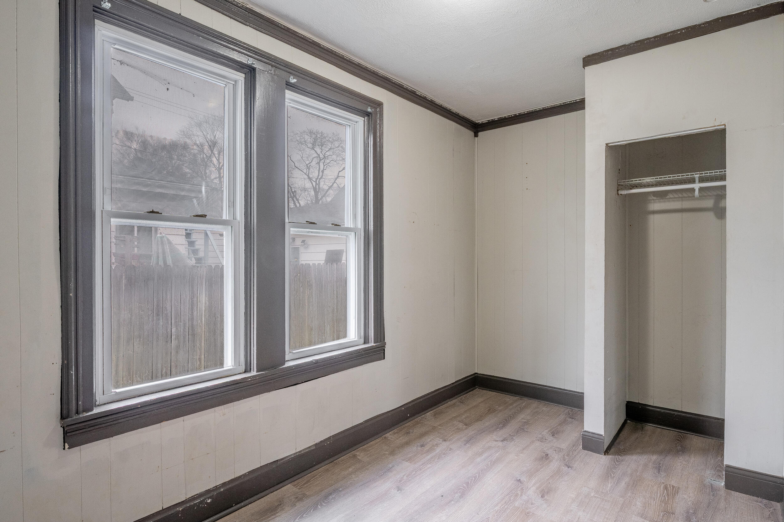 403 Rose Street La Porte, IN 46350 - Photo 18 of 28 a view of an empty room with wooden floor and a window