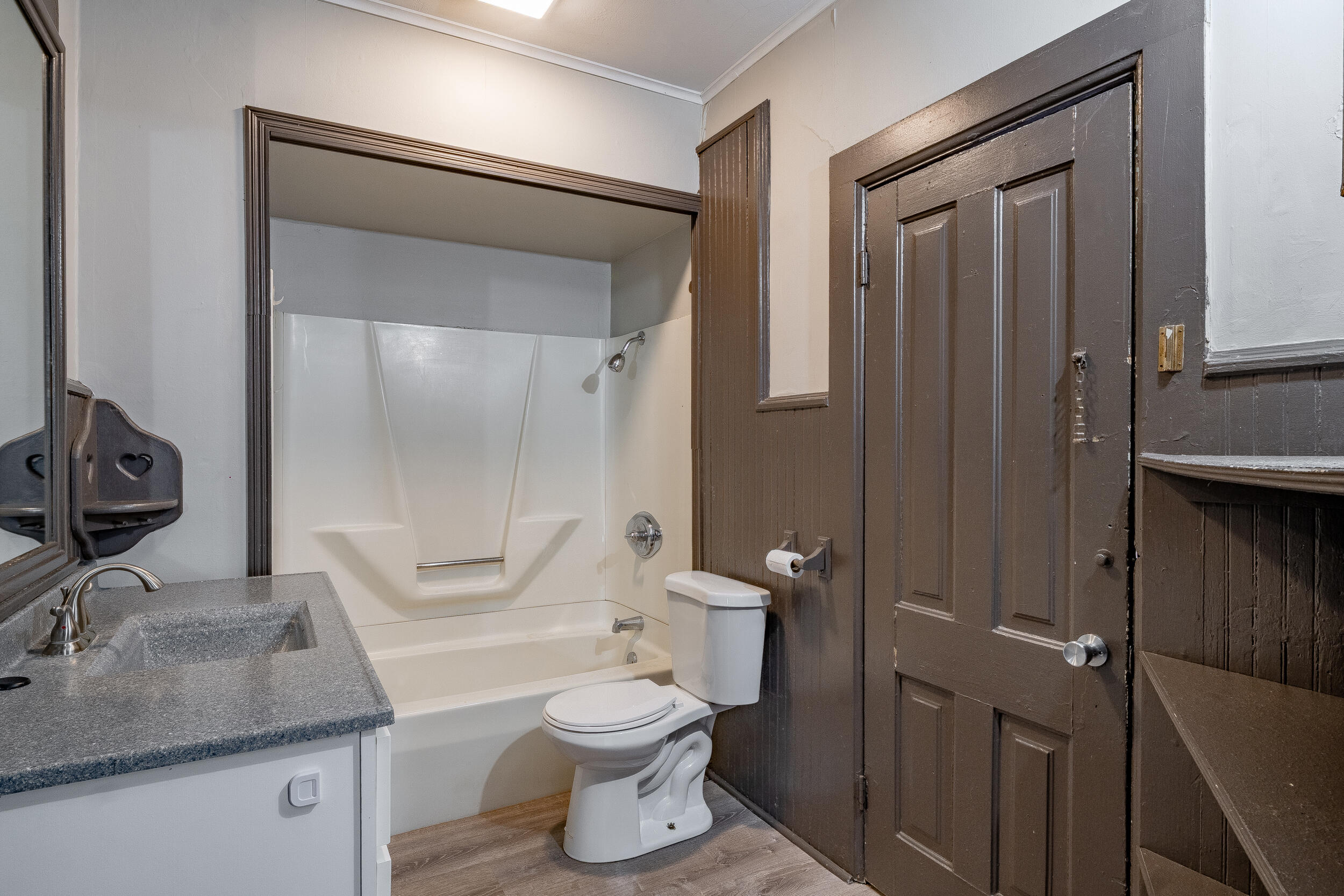 403 Rose Street La Porte, IN 46350 - Photo 20 of 28 a bathroom with a granite countertop sink toilet and shower