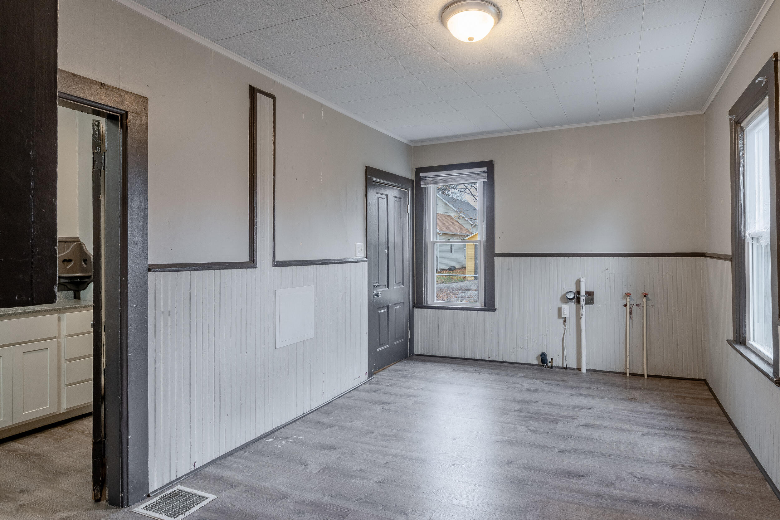 403 Rose Street La Porte, IN 46350 - Photo 22 of 28 an empty room with wooden floor and windows