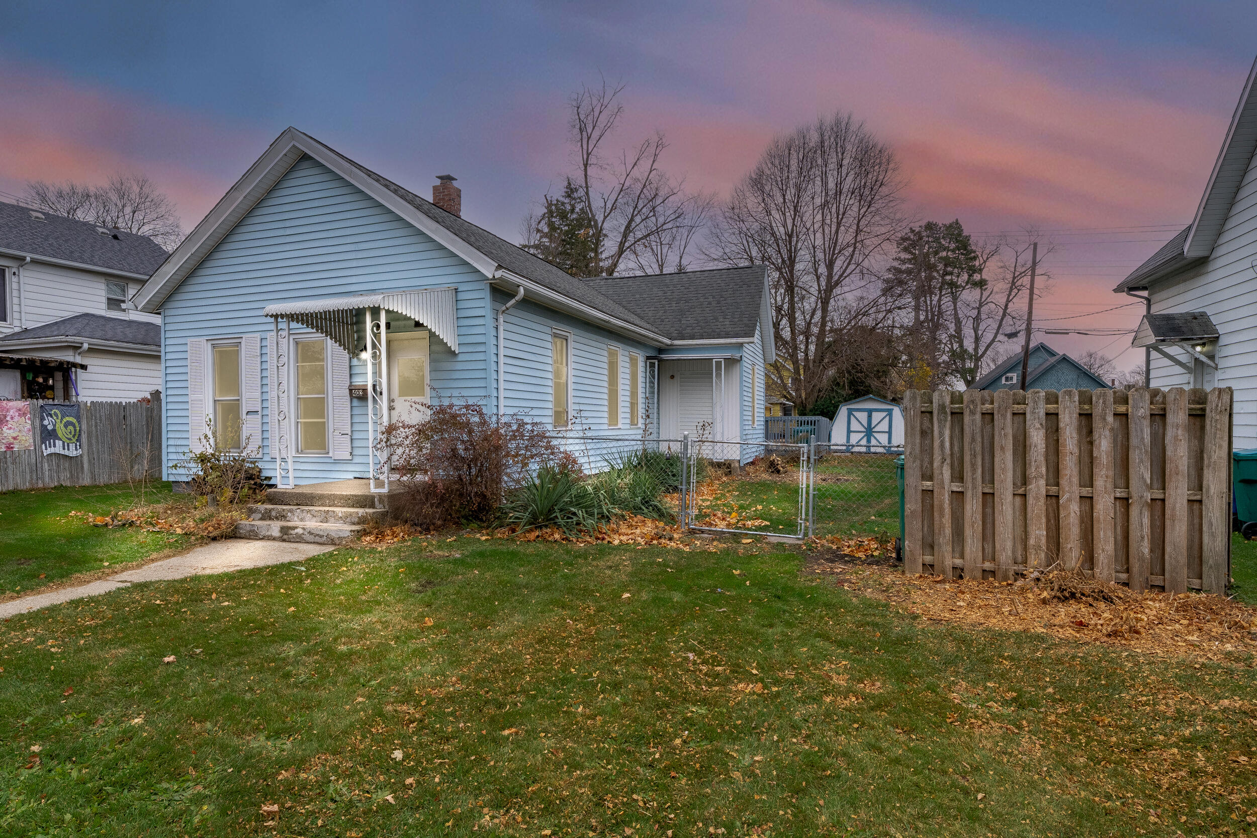 403 Rose Street La Porte, IN 46350 - Photo 25 of 28 a front view of a house with yard and green space