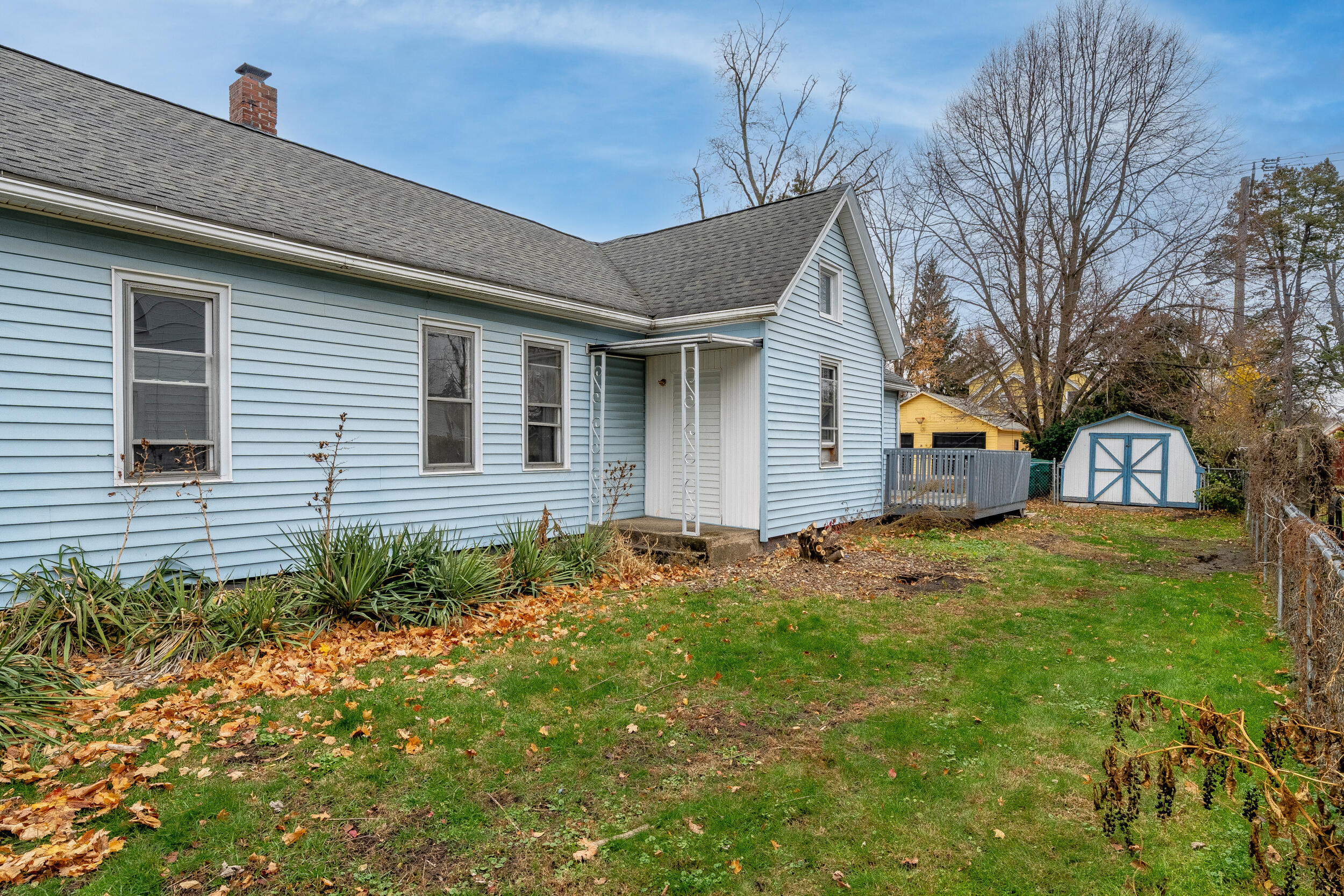 403 Rose Street La Porte, IN 46350 - Photo 26 of 28 a backyard of a house with plants and large tree
