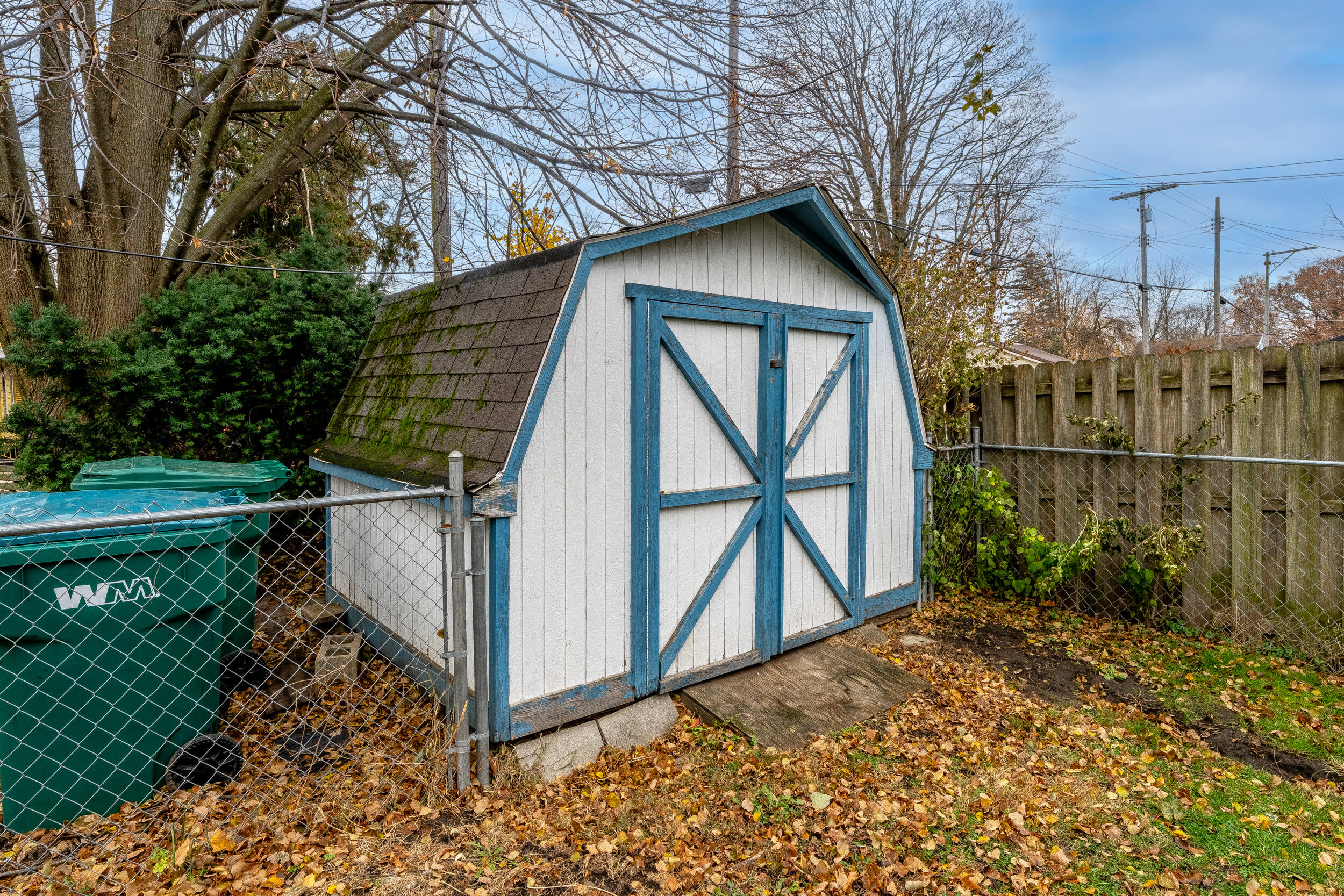 403 Rose Street La Porte, IN 46350 - Photo 28 of 28 a view of a wooden house with a small yard and wooden fence