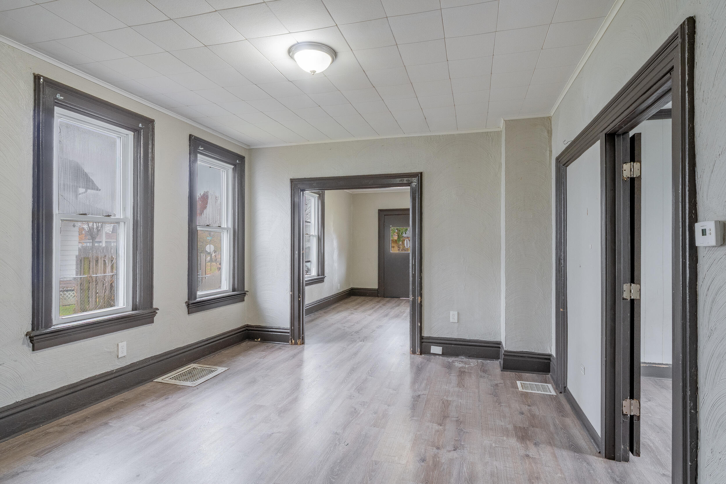 403 Rose Street La Porte, IN 46350 - Photo 9 of 28 wooden floor and windows in an empty room