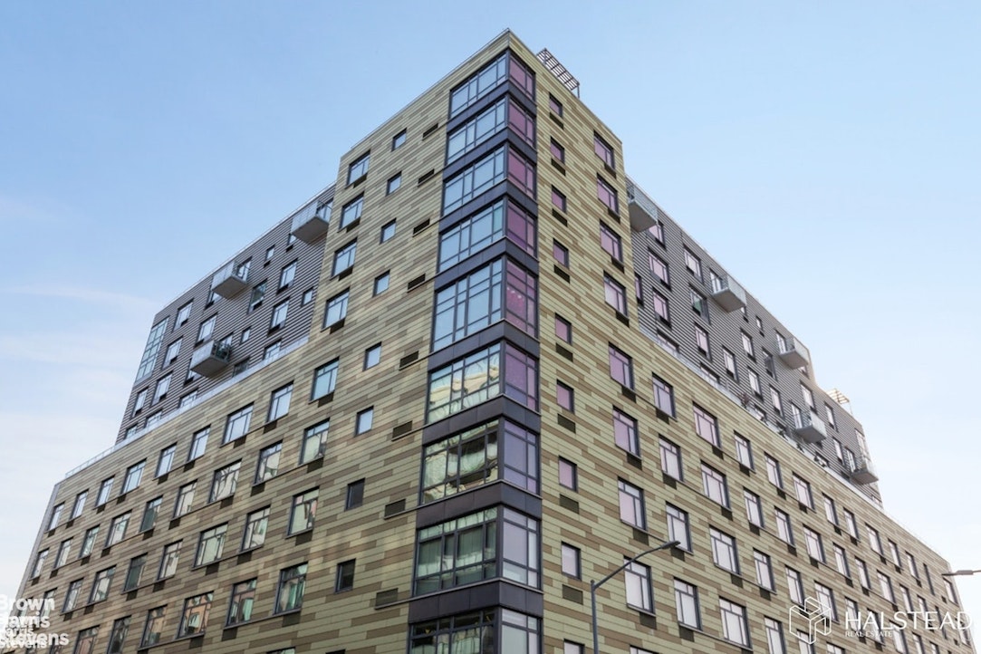 11-02 49th Avenue, Unit 8A Queens, NY 11101 - Photo 16 of 36 a view of a tall building