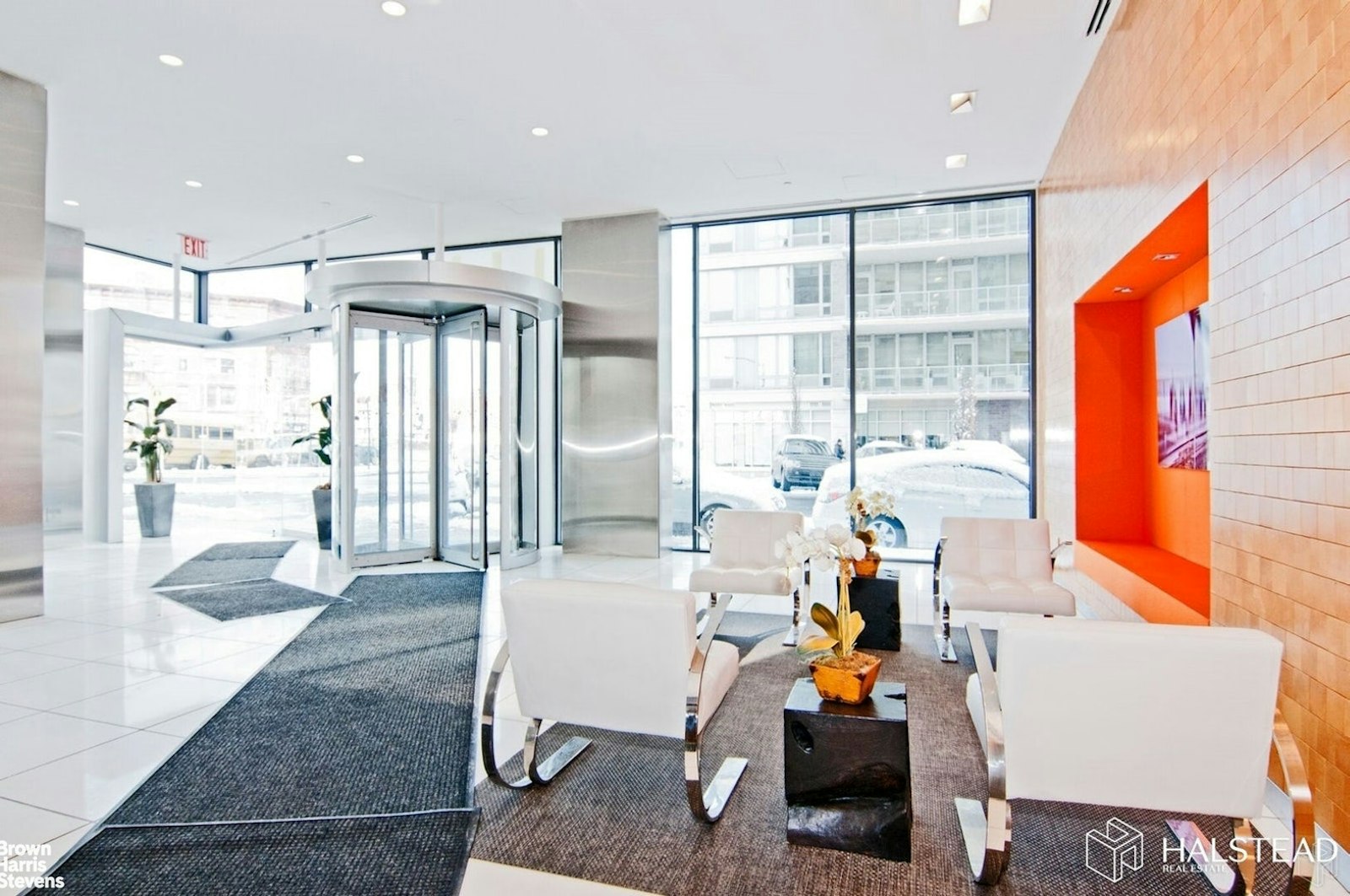 11-02 49th Avenue, Unit 8A Queens, NY 11101 - Photo 27 of 36 a living room filled with furniture and a large window