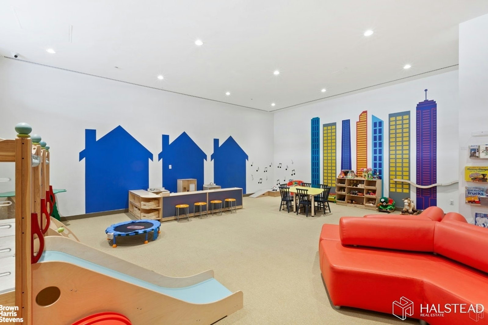 11-02 49th Avenue, Unit 8A Queens, NY 11101 - Photo 30 of 36 a living room with furniture gym equipment and a large window