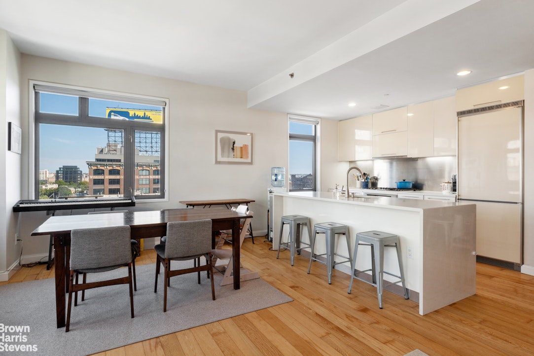 11-02 49th Avenue, Unit 8A Queens, NY 11101 - Photo 3 of 36 a kitchen with white cabinets and counter space