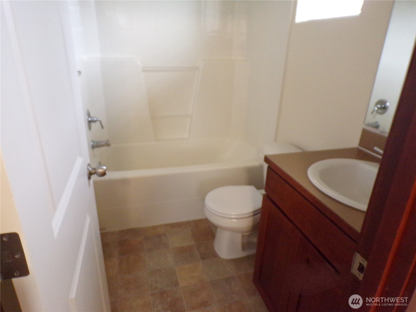 501 North 105th Street, Unit A Seattle, WA 98133 - Photo 21 of 39 a bathroom with a sink a toilet and shower