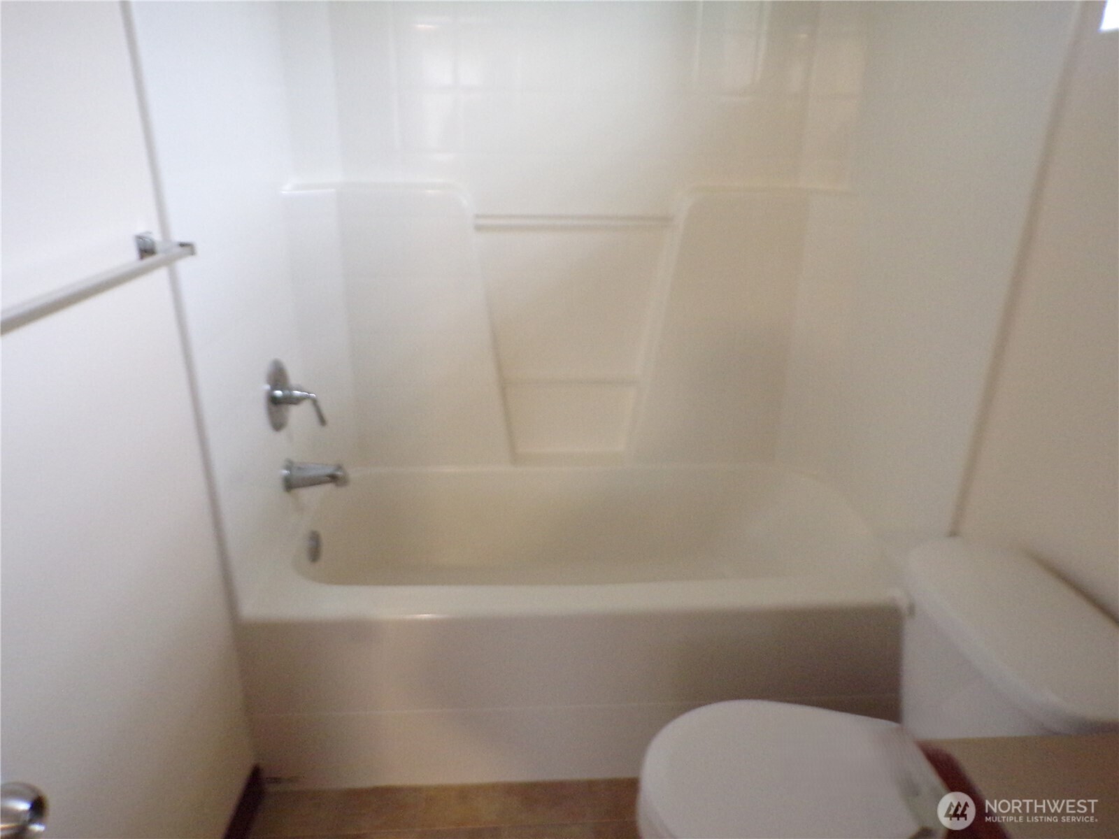 501 North 105th Street, Unit A Seattle, WA 98133 - Photo 22 of 39 a bathroom with a toilet and bathtub