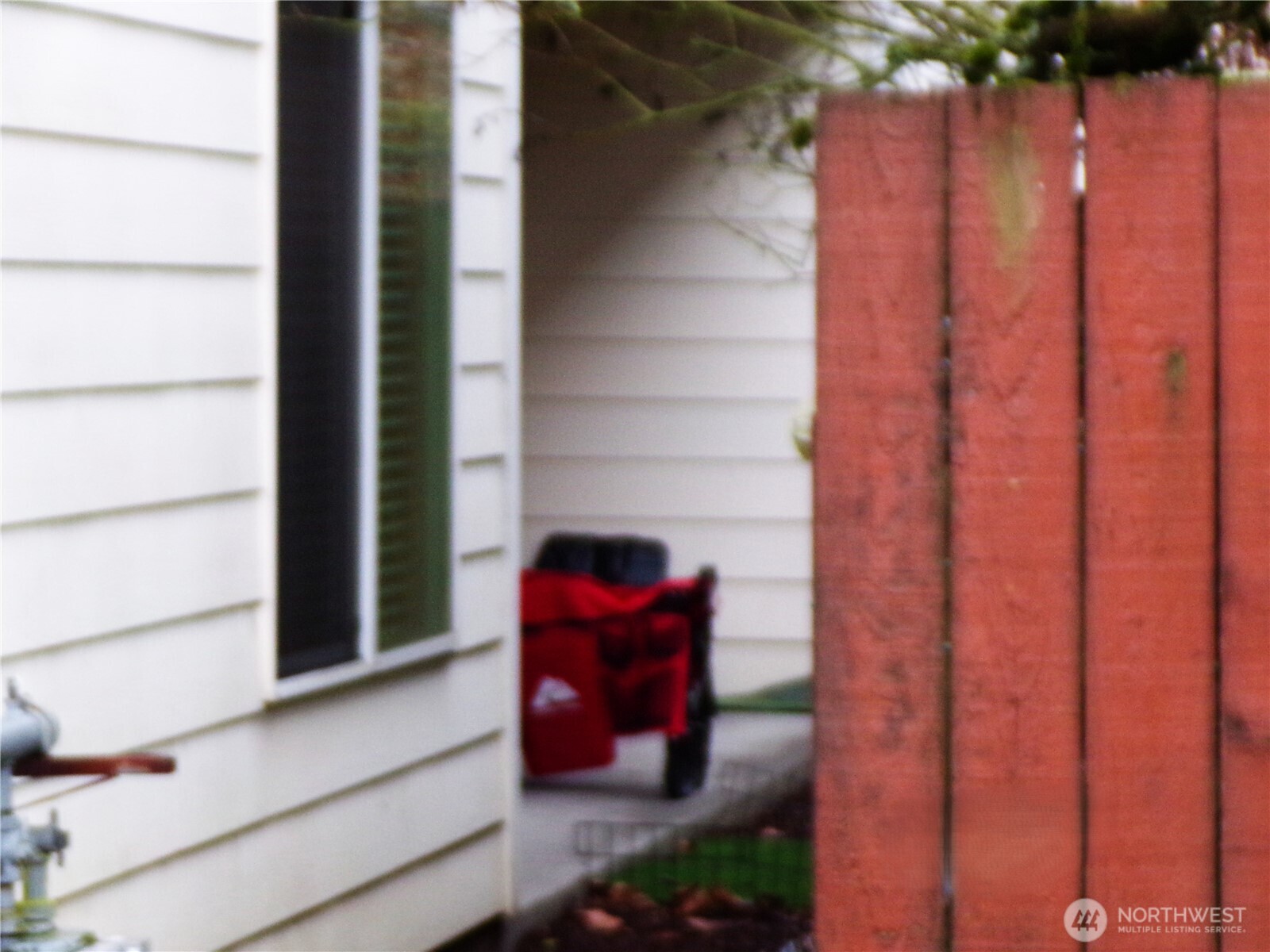501 North 105th Street, Unit A Seattle, WA 98133 - Photo 35 of 39 a view of a door and chair in the patio