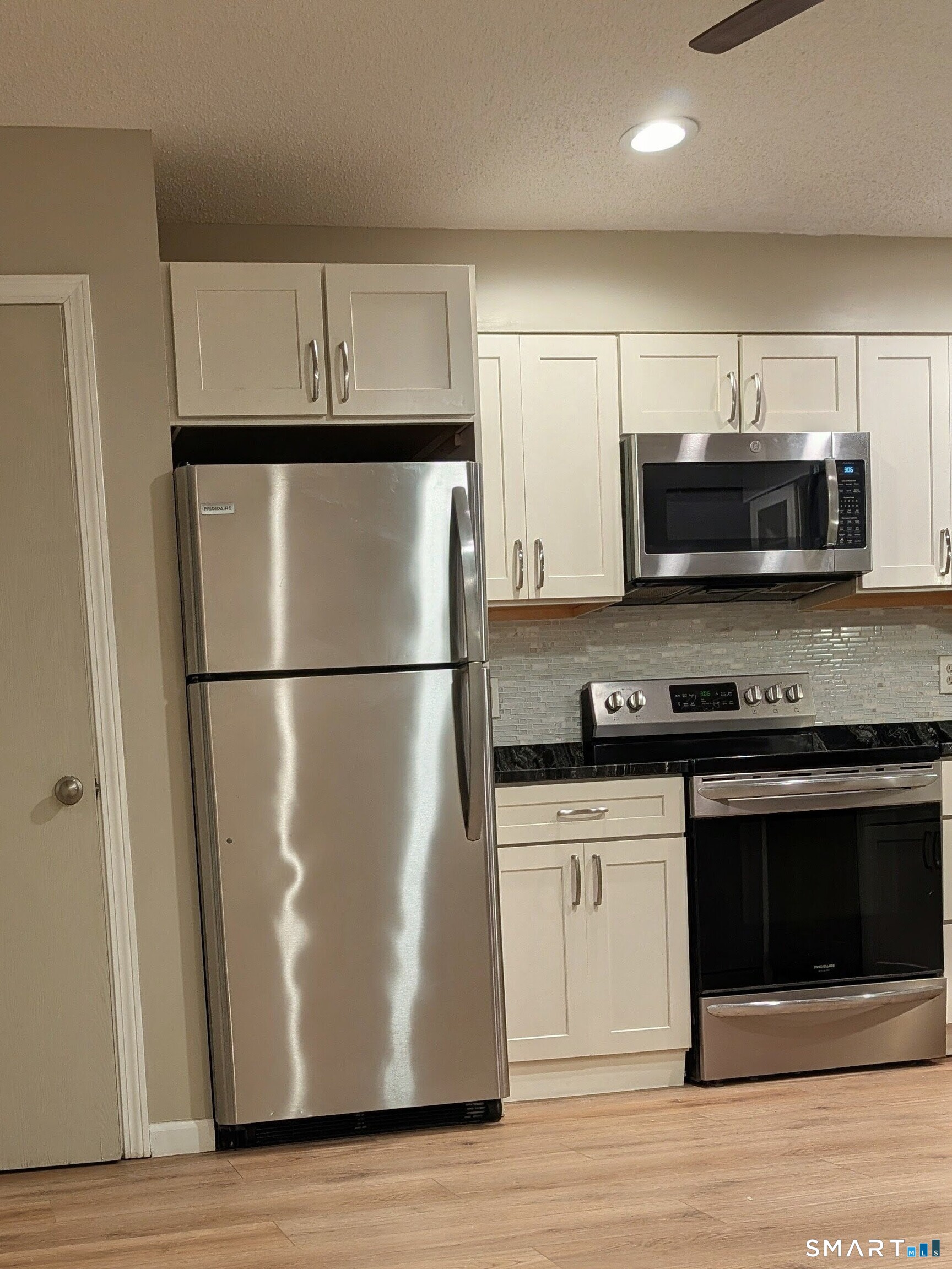 975 Meriden Road, Unit 36 Waterbury, CT 06705 - Photo 5 of 28 assorted white micro tiles of glass and ceramic