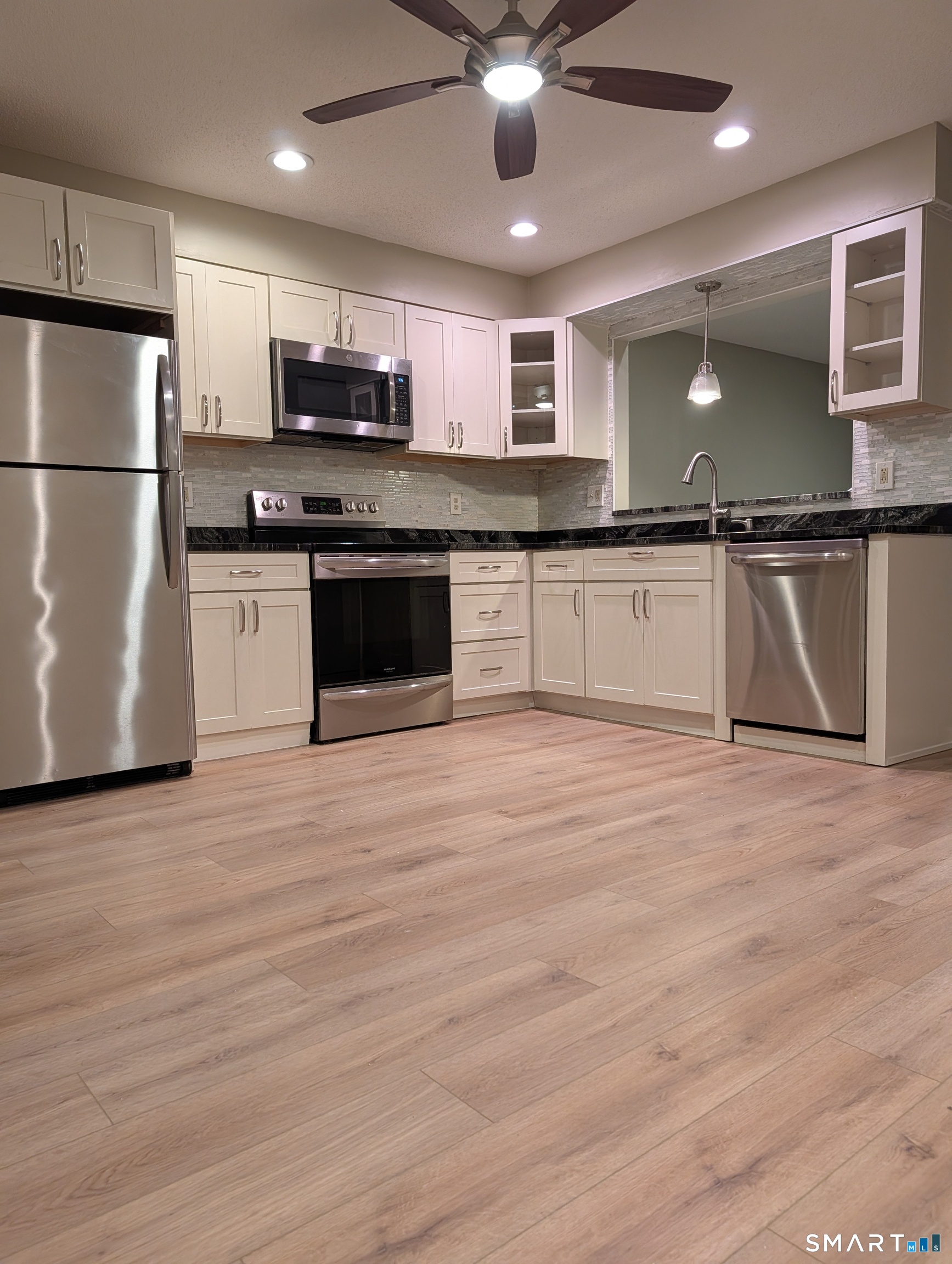 975 Meriden Road, Unit 36 Waterbury, CT 06705 - Photo 6 of 28 wide plank vinyl flooring