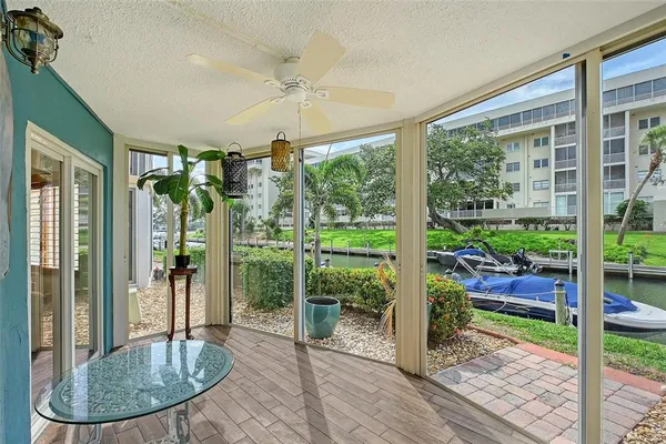 an aerial view of a house with balcony and outdoor space