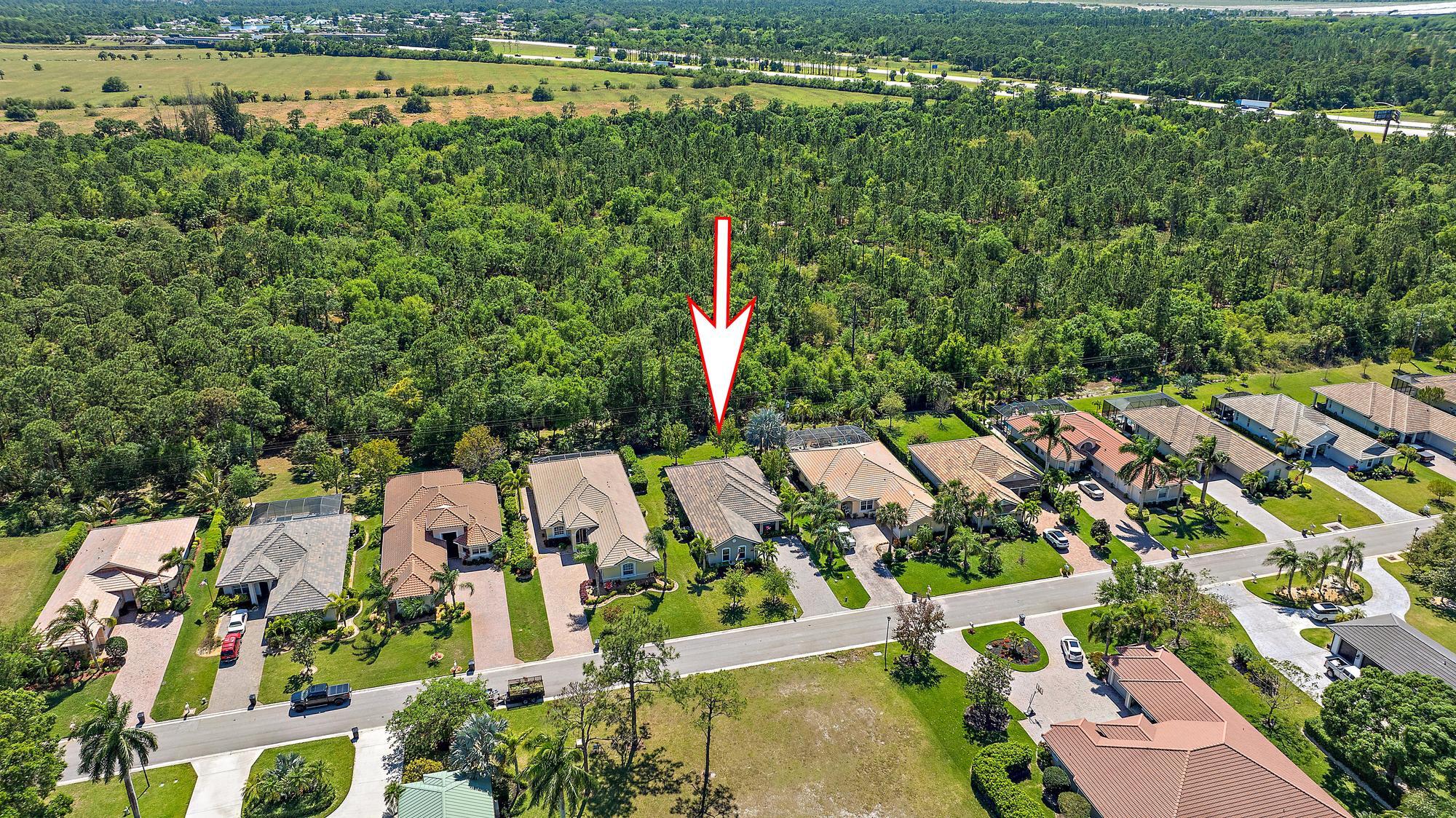 2664 Conifer Drive Fort Pierce, FL 34951 - Photo 24 of 30 an aerial view of residential houses with outdoor space and lake view