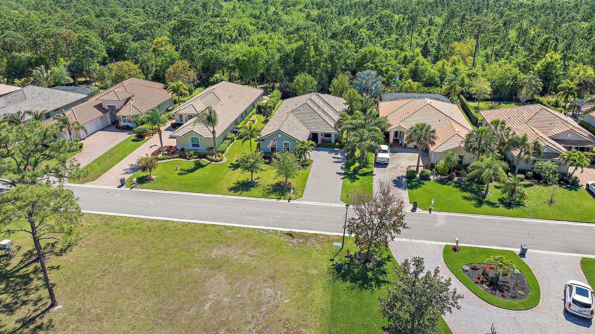 2664 Conifer Drive Fort Pierce, FL 34951 - Photo 25 of 30 an aerial view of a house with swimming pool and garden