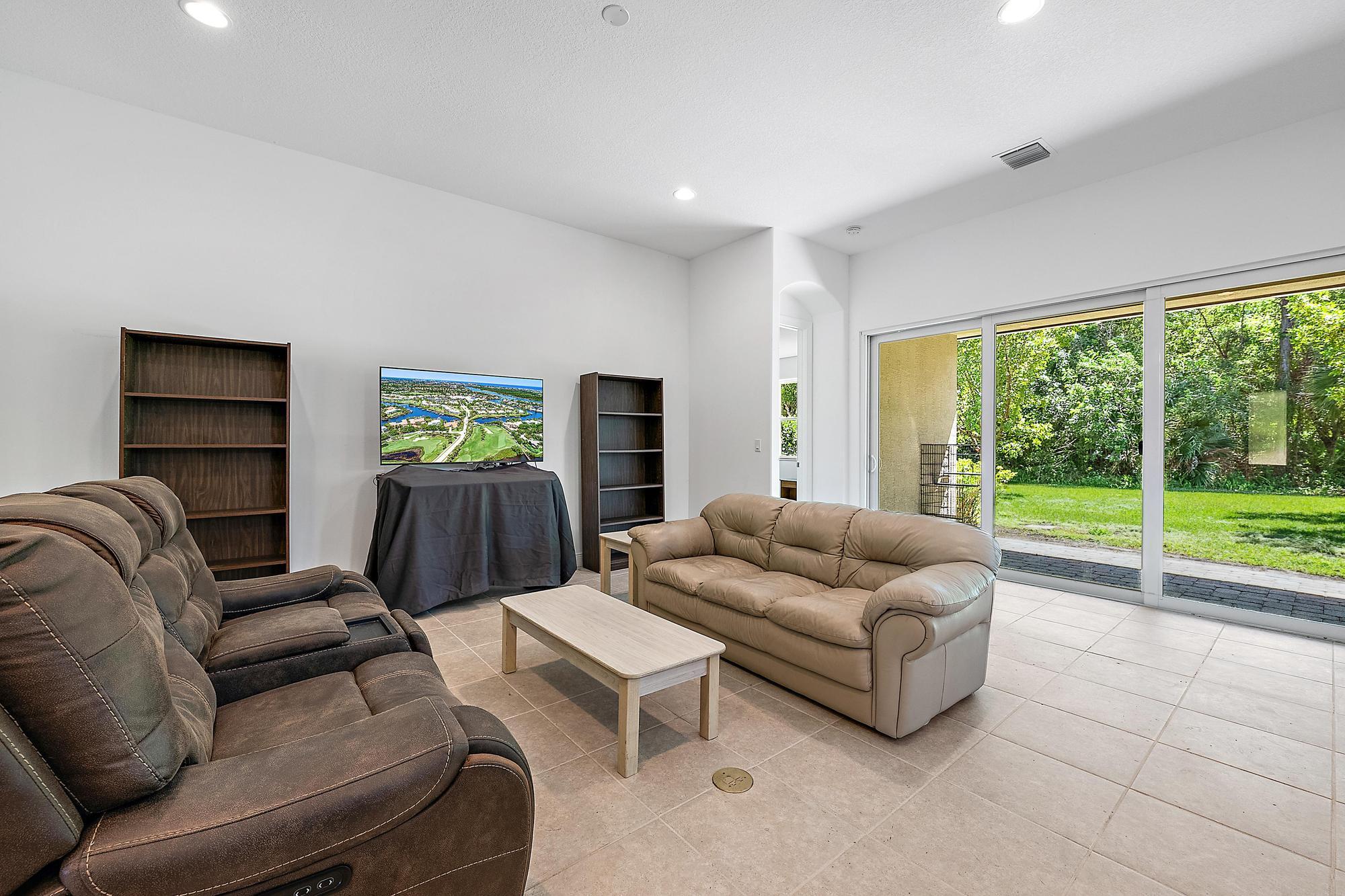 2664 Conifer Drive Fort Pierce, FL 34951 - Photo 10 of 30 a living room with furniture and a large window