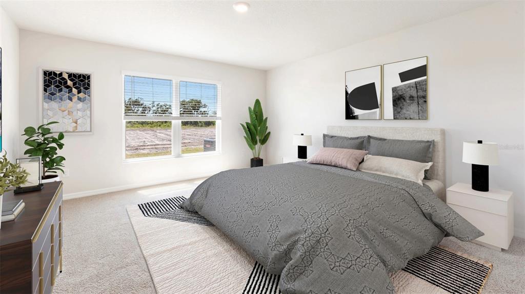 1922 Hammock Trace Drive Parrish, FL 34219 - Photo 12 of 18 a bedroom with a large bed and a potted plant