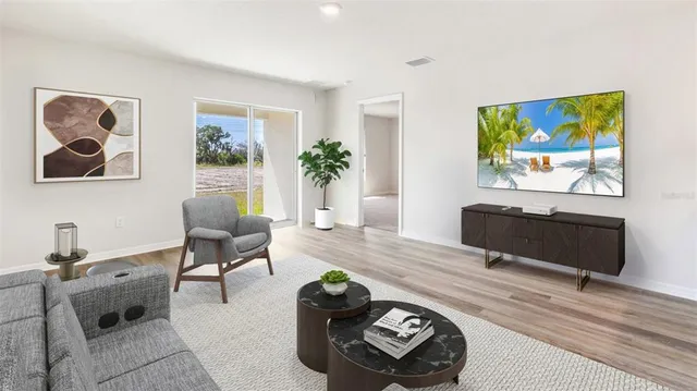 a kitchen with stainless steel appliances a refrigerator a sink a stove a microwave and cabinets