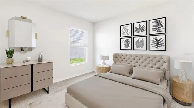 a bedroom with a bed and painting on the wall