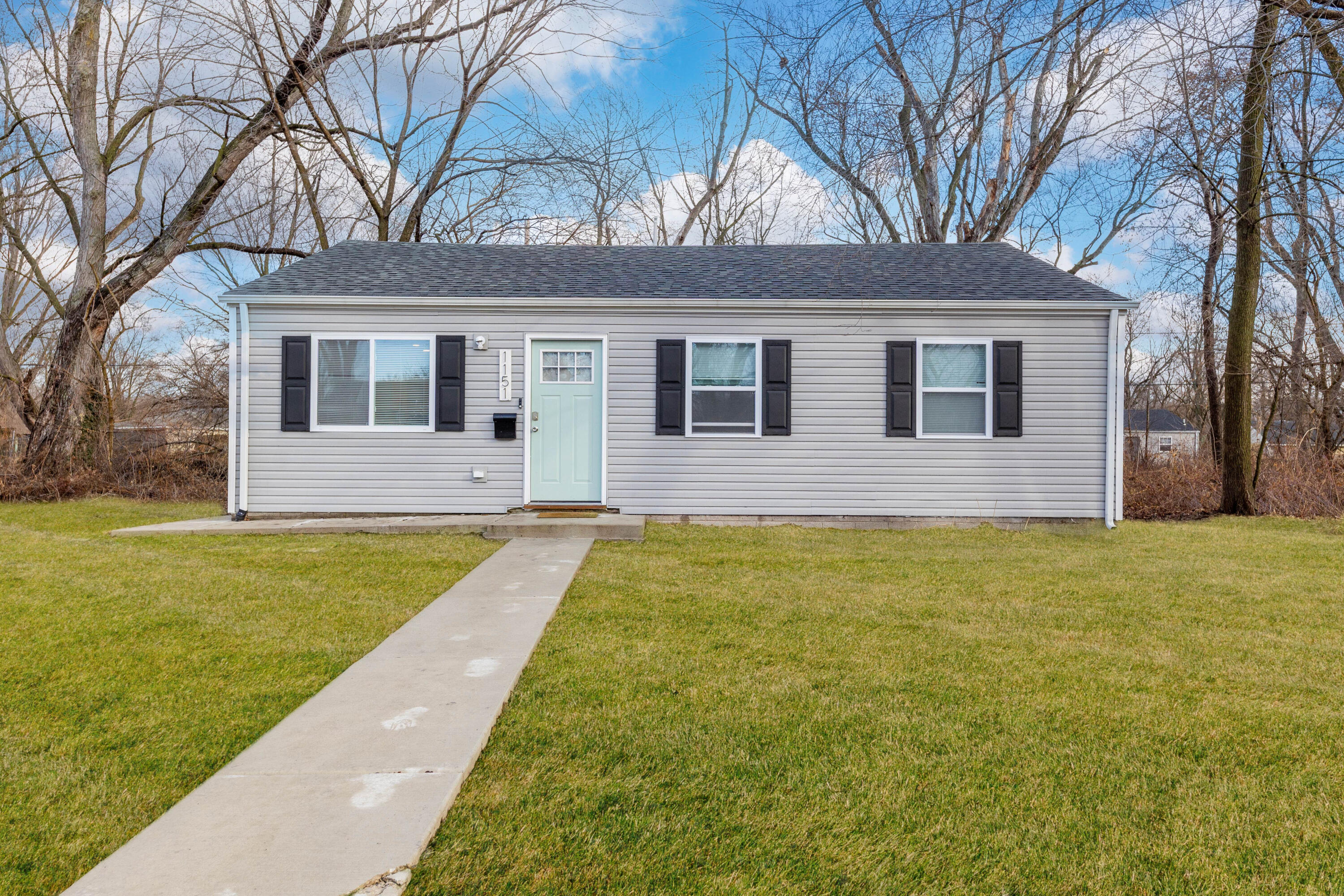 1151 Benton Street Gary, IN 46403 - Photo 1 of 23 a front view of a house with yard