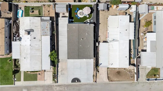 a white house with palm tree in front of it