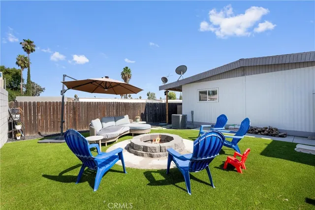 a swimming pool with outdoor seating