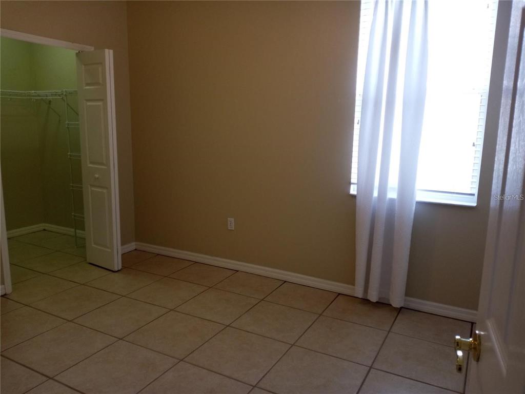 6506 Waters Edge Way Lakewood Ranch, FL 34202 - Photo 10 of 14 an empty room with a door