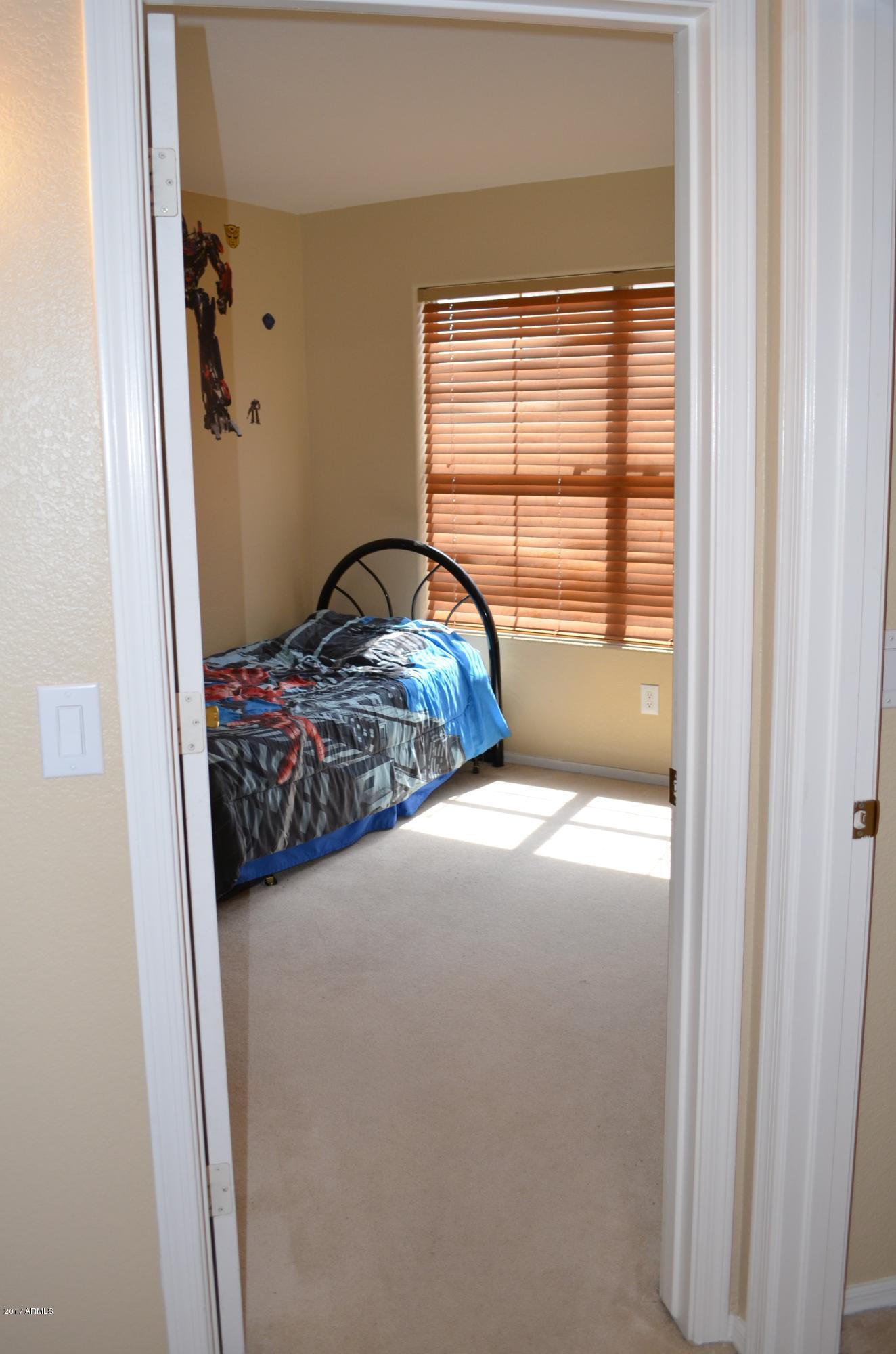1742 East Del Rio Street Gilbert, AZ 85295 - Photo 11 of 28 a bedroom with a bed and a window