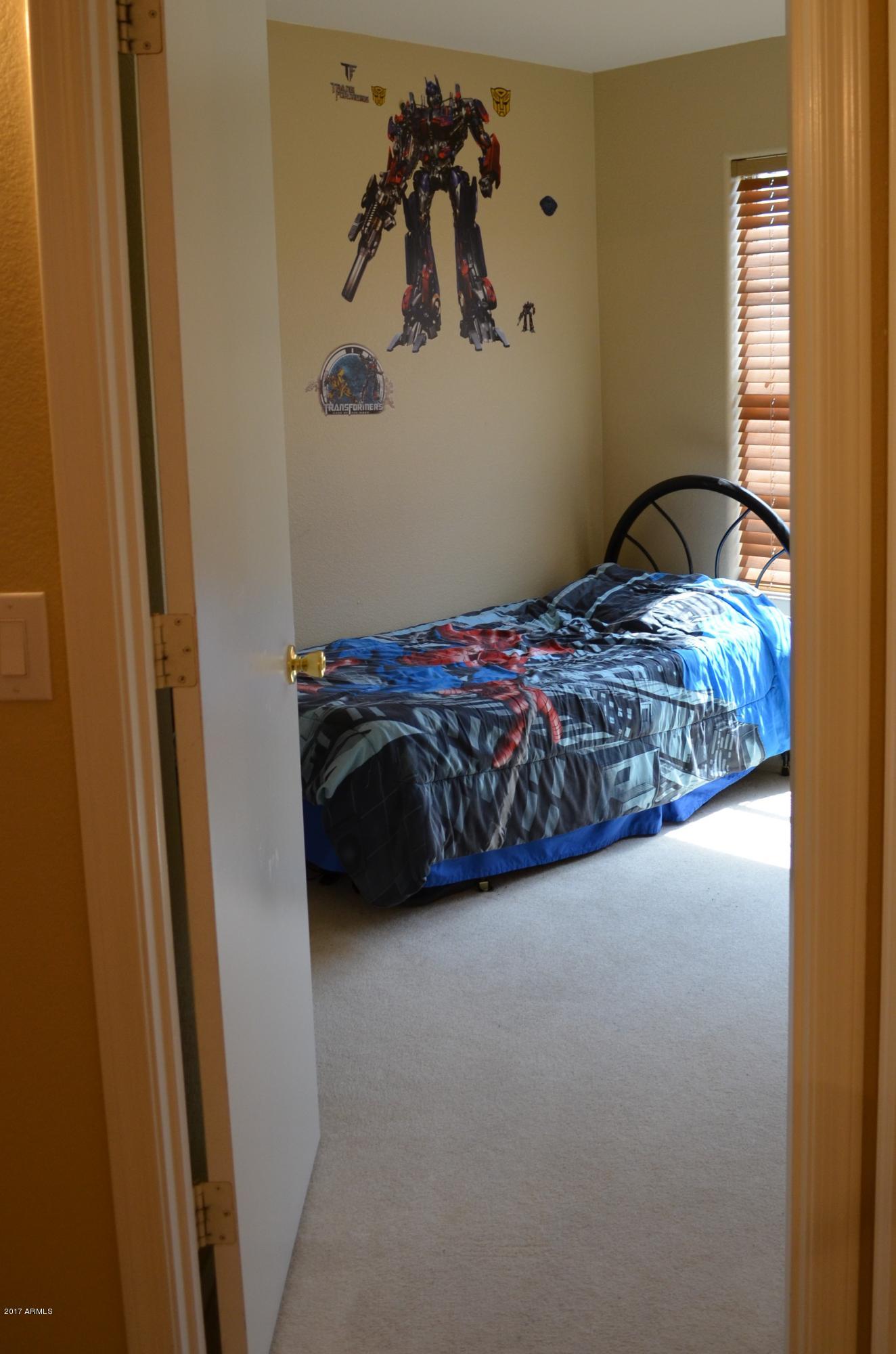 1742 East Del Rio Street Gilbert, AZ 85295 - Photo 12 of 28 a bedroom with a bed and a window
