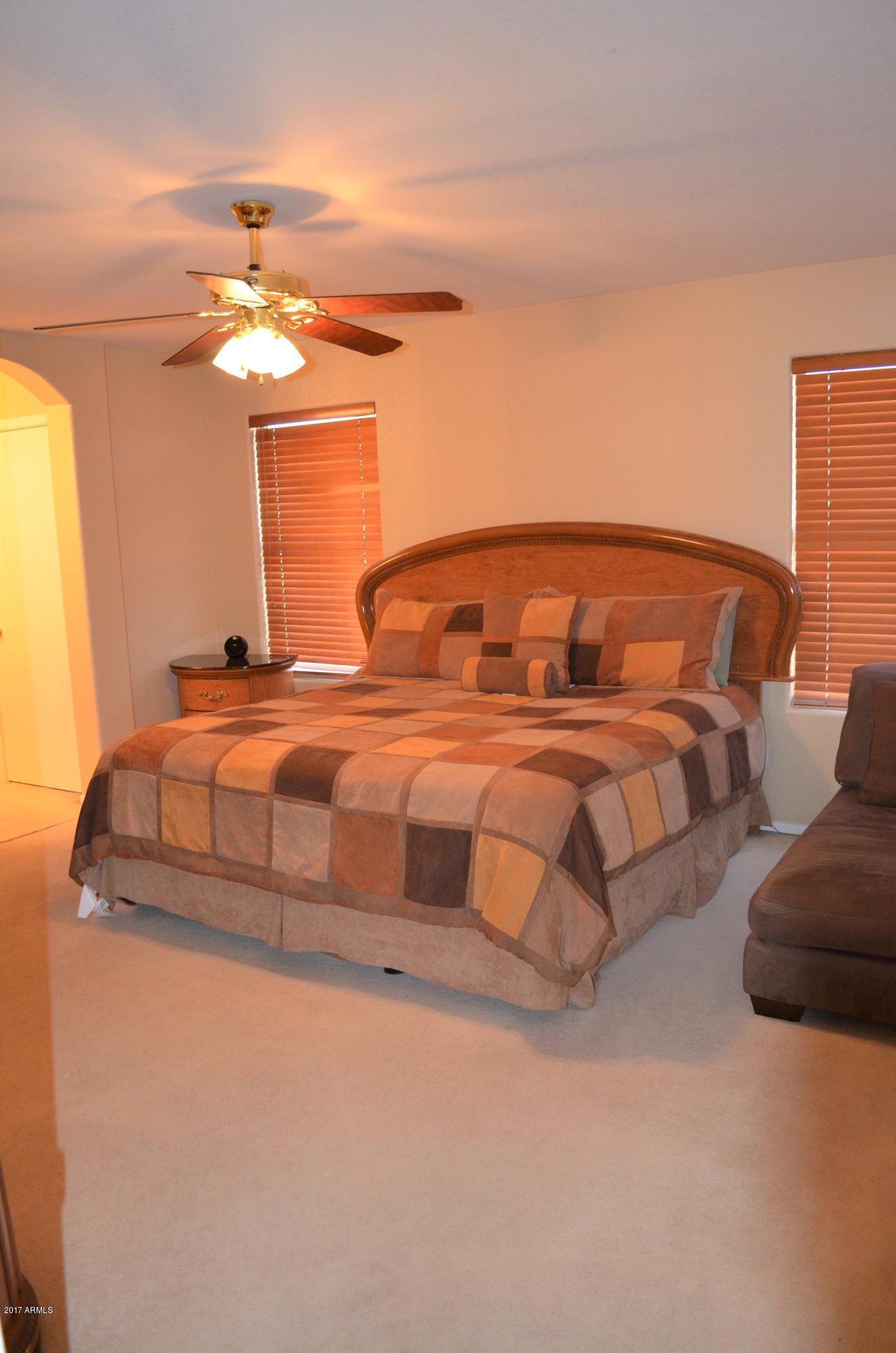 1742 East Del Rio Street Gilbert, AZ 85295 - Photo 14 of 28 a bedroom with a bed and window