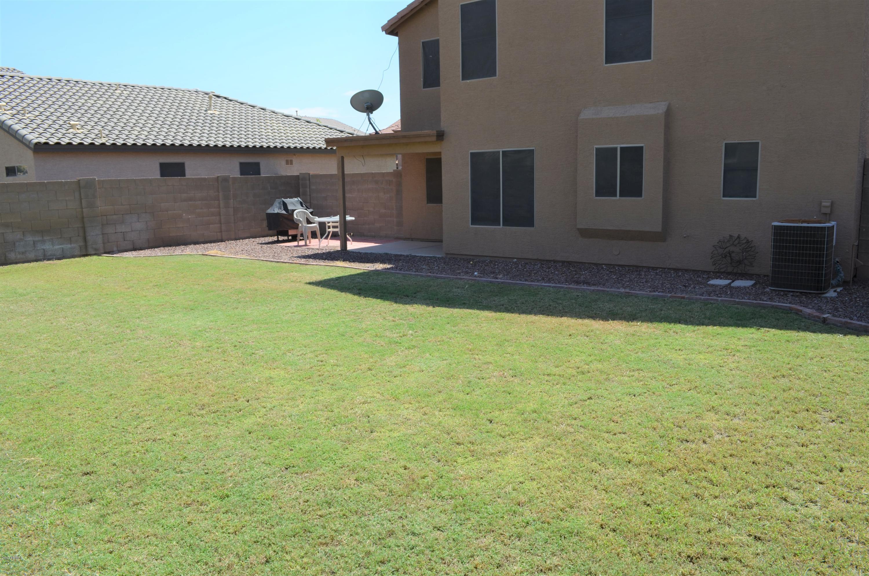 1742 East Del Rio Street Gilbert, AZ 85295 - Photo 17 of 28 a view of a patio with table and chairs