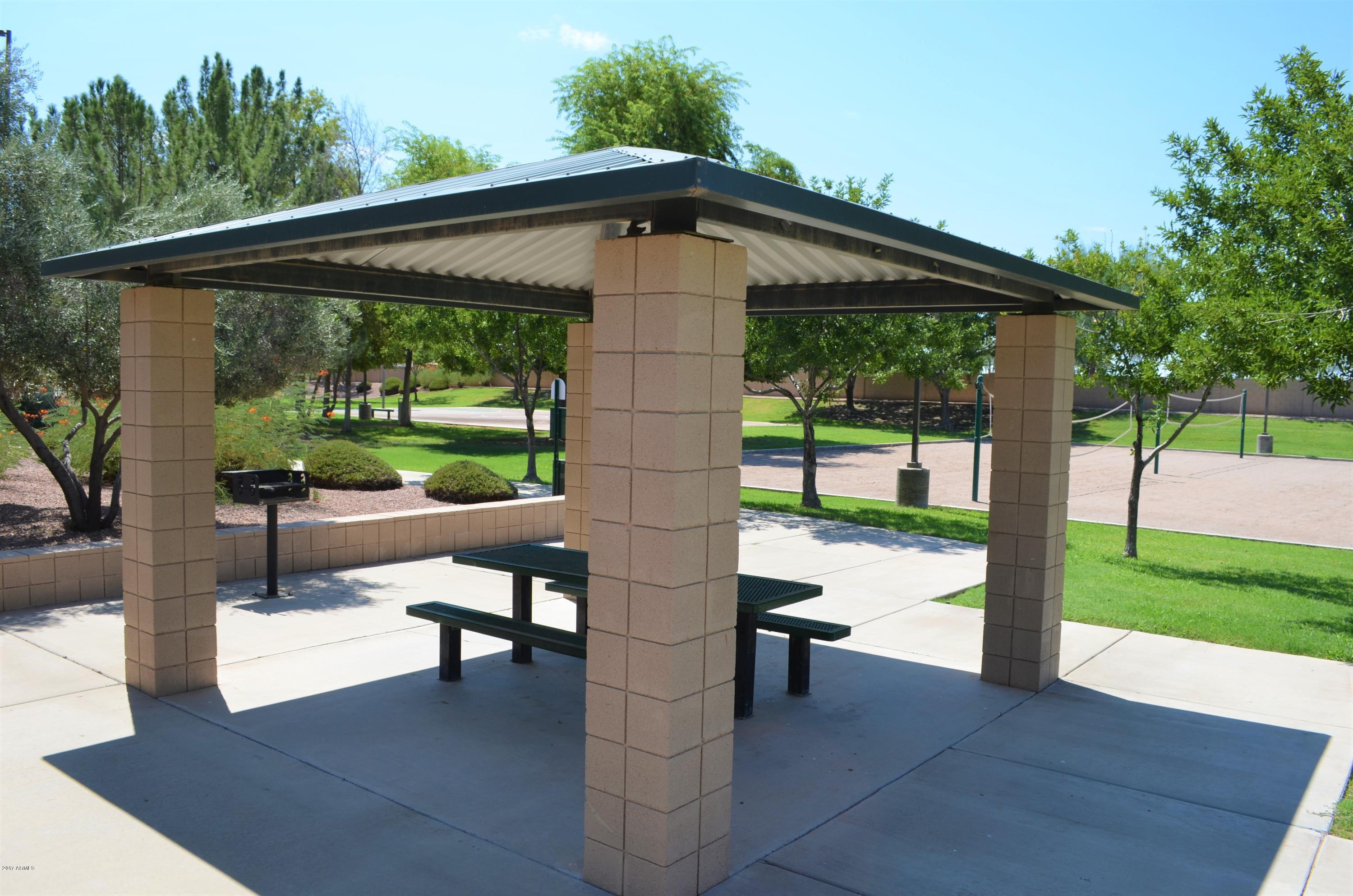 1742 East Del Rio Street Gilbert, AZ 85295 - Photo 27 of 28 a view of a patio with a table chairs and a backyard