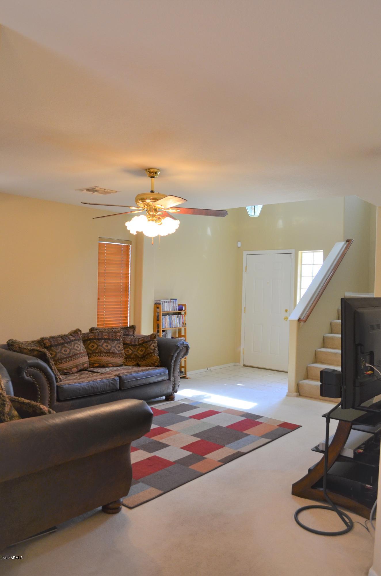1742 East Del Rio Street Gilbert, AZ 85295 - Photo 6 of 28 a living room with furniture and a flat screen tv