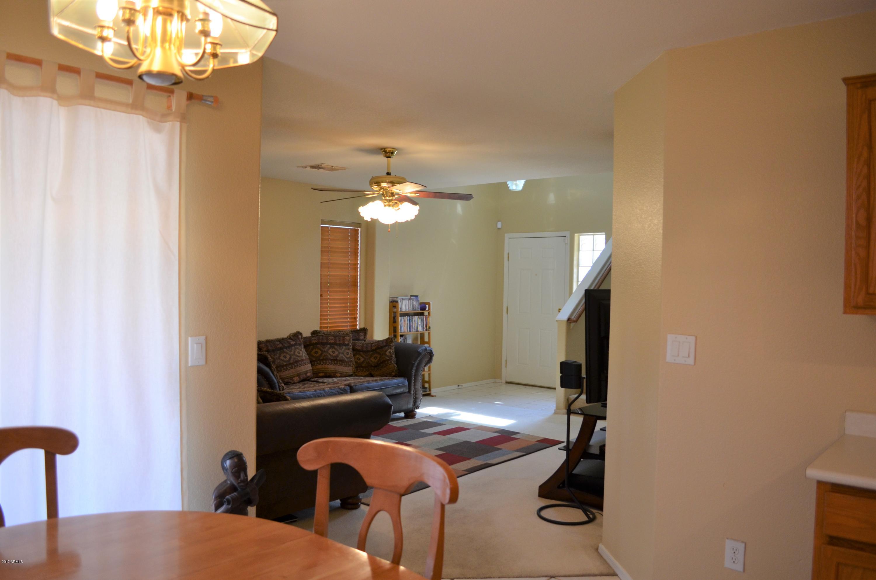 1742 East Del Rio Street Gilbert, AZ 85295 - Photo 7 of 28 a view of a livingroom with furniture and a chandelier