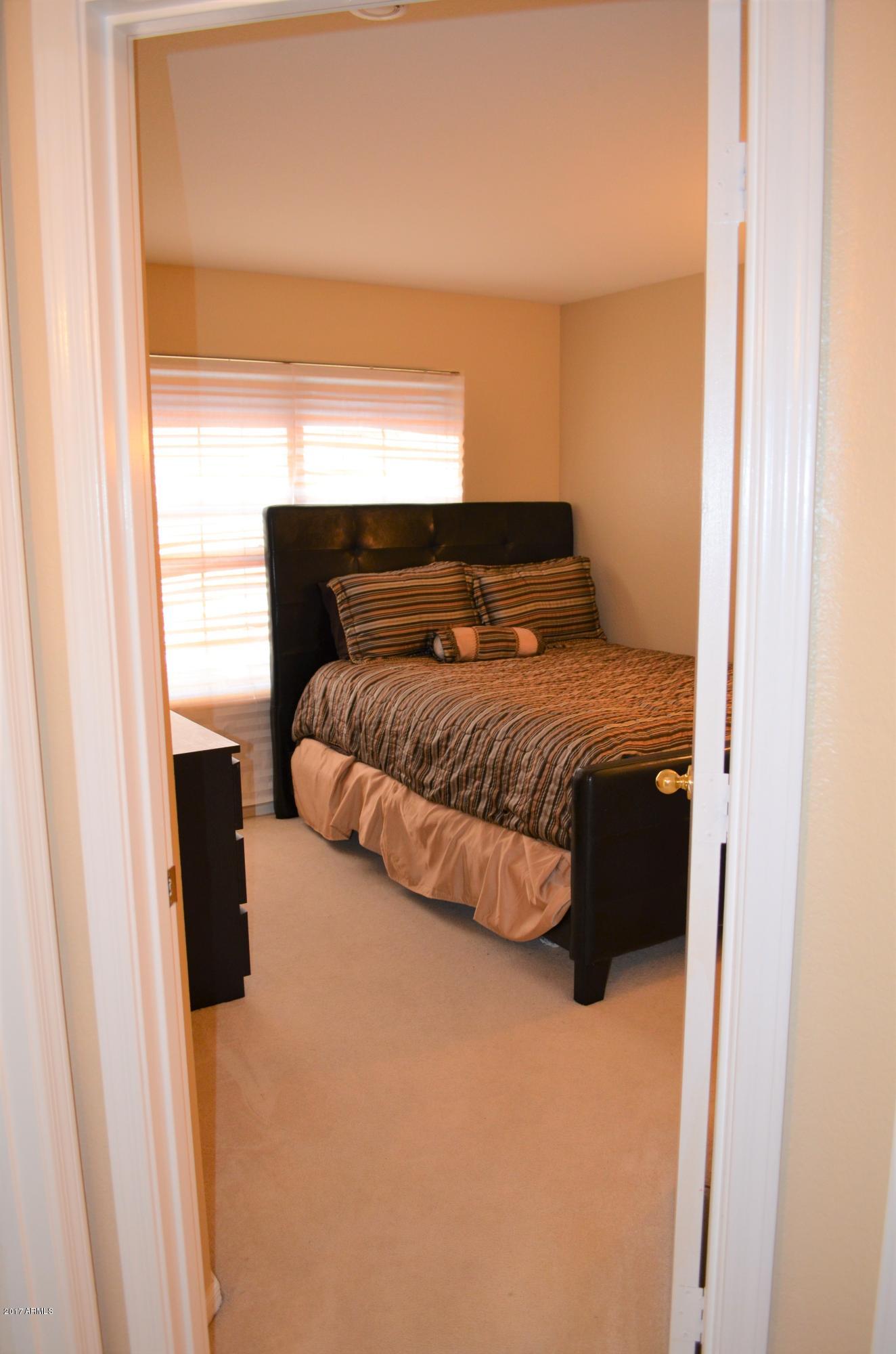 1742 East Del Rio Street Gilbert, AZ 85295 - Photo 9 of 28 a bedroom with a bed and a window