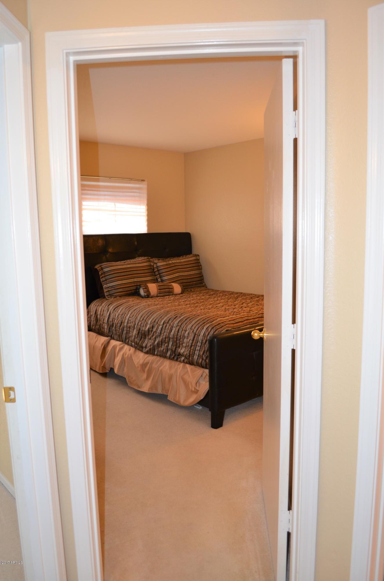 1742 East Del Rio Street Gilbert, AZ 85295 - Photo 10 of 28 a bedroom with a bed and a window