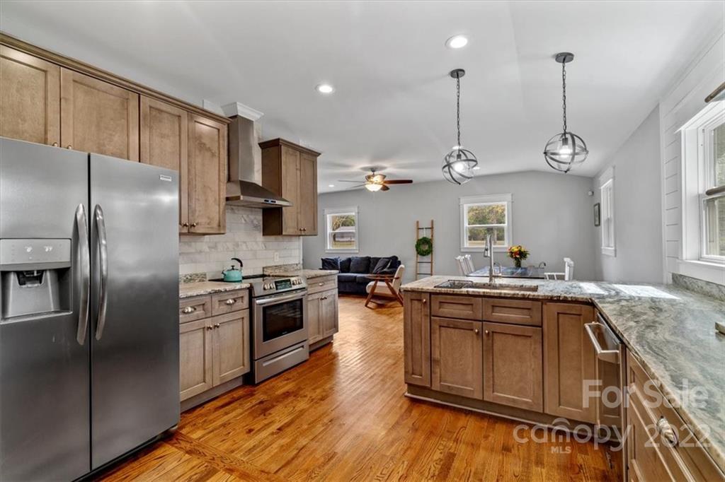 1631 Lawrence Road Clover, SC 29710 - Photo 20 of 48 a kitchen with stainless steel appliances granite countertop a sink a stove and refrigerator