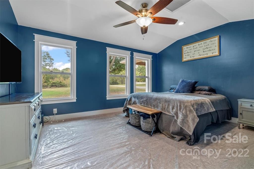 1631 Lawrence Road Clover, SC 29710 - Photo 24 of 48 a bedroom with a large bed and a flat screen tv