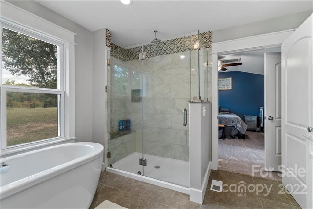 1631 Lawrence Road Clover, SC 29710 - Photo 27 of 48 a bathroom with a tub shower and a sink