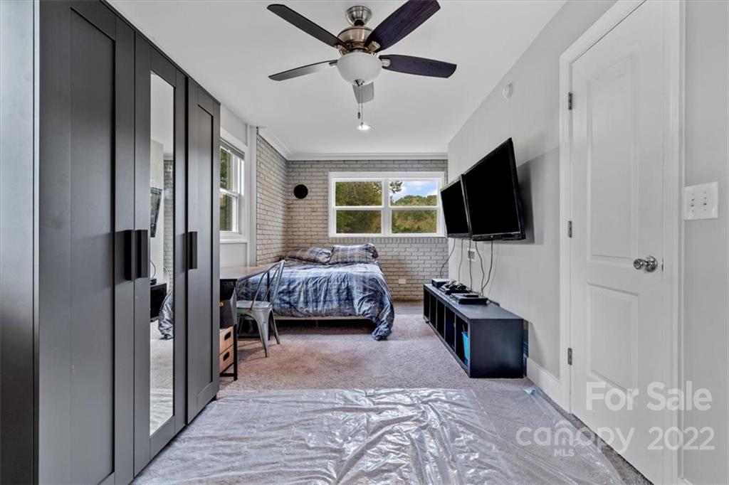 1631 Lawrence Road Clover, SC 29710 - Photo 32 of 48 a bedroom with furniture and a flat screen tv