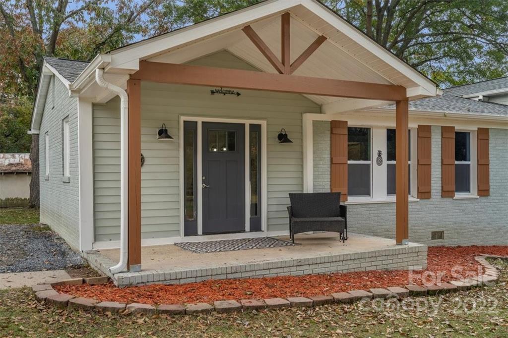 1631 Lawrence Road Clover, SC 29710 - Photo 6 of 48 a view of a house with a bench in the patio