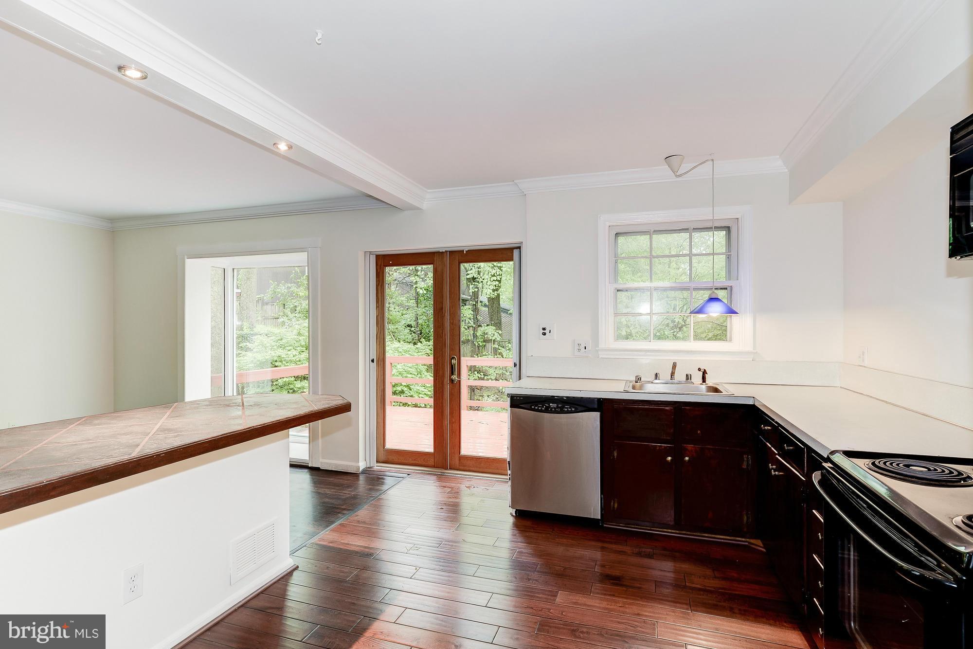 6308 Greentree Road Bethesda, MD 20817 - Photo 6 of 18 Kitchen w/ French Doors to Rear Deck
