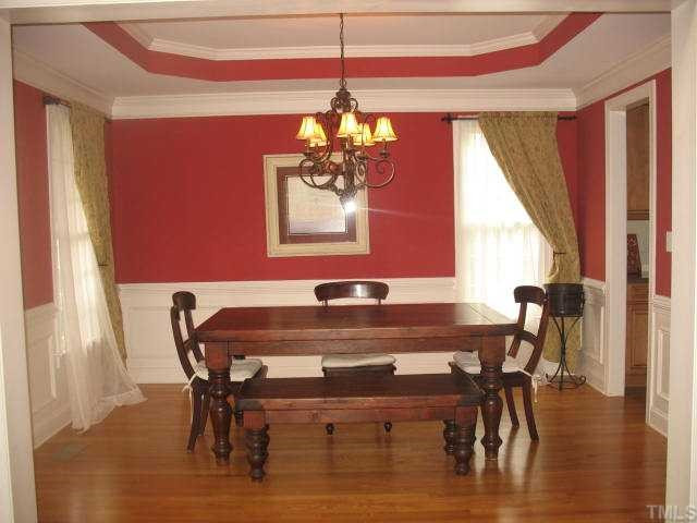 10311 Evergreen Spring Place Raleigh, NC 27614 - Photo 5 of 12 The formal dining room is a perfect spot for gatherings. With heavy moldings and a deep trey ceiling, it is a lovely focal point of your new home. Dining Room