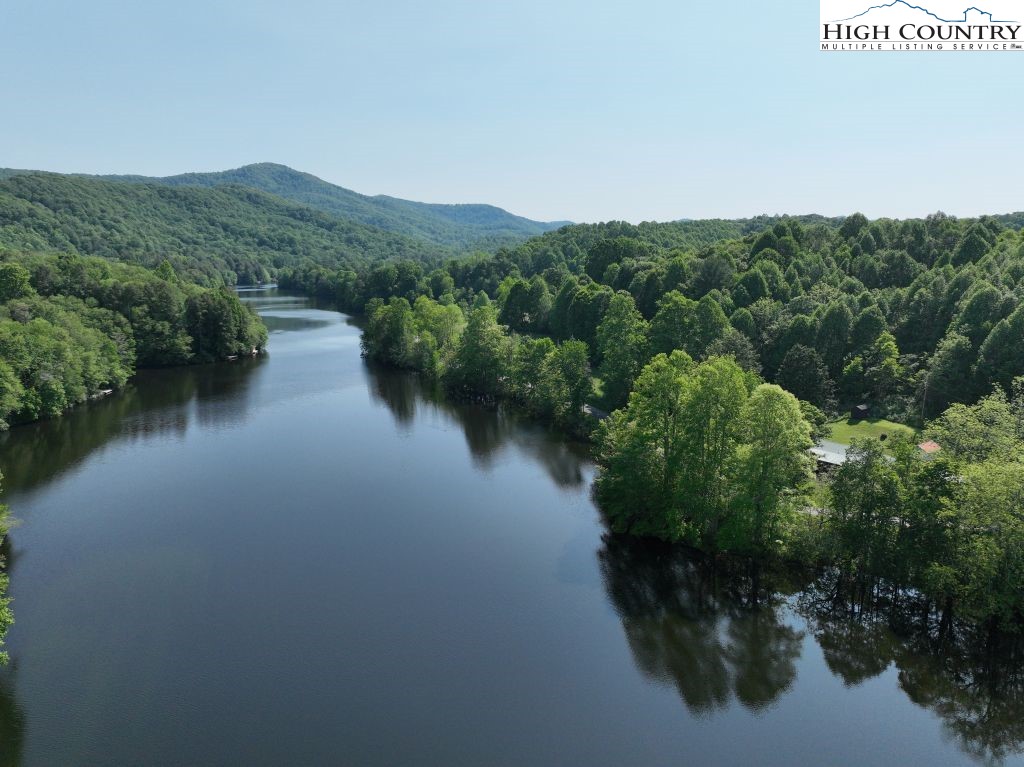 1772 Ripshin Mountain Road Roan Mountain, TN 37687 - Photo 19 of 30 a view of a lake with a mountain in the background