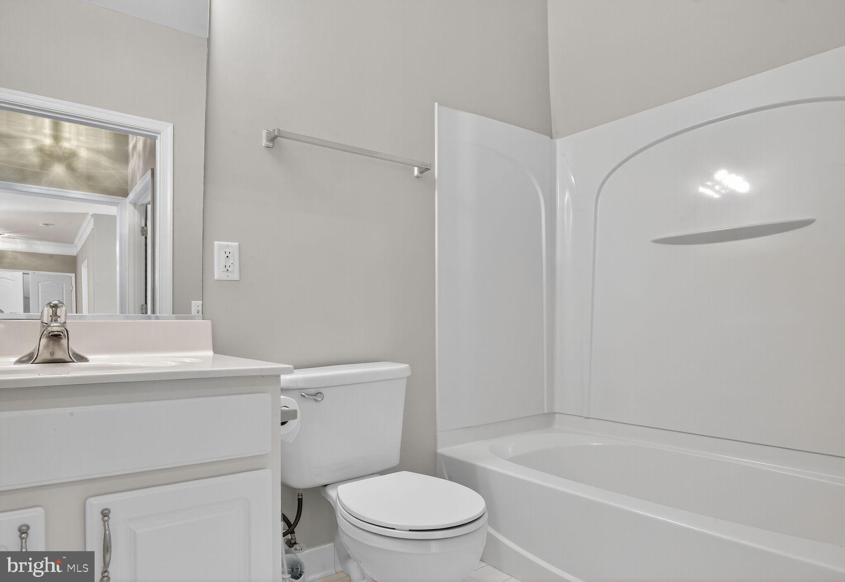 402 Aggies Circle, Unit 402D Bel Air, MD 21014 - Photo 16 of 29 a bathroom with a sink a toilet and shower