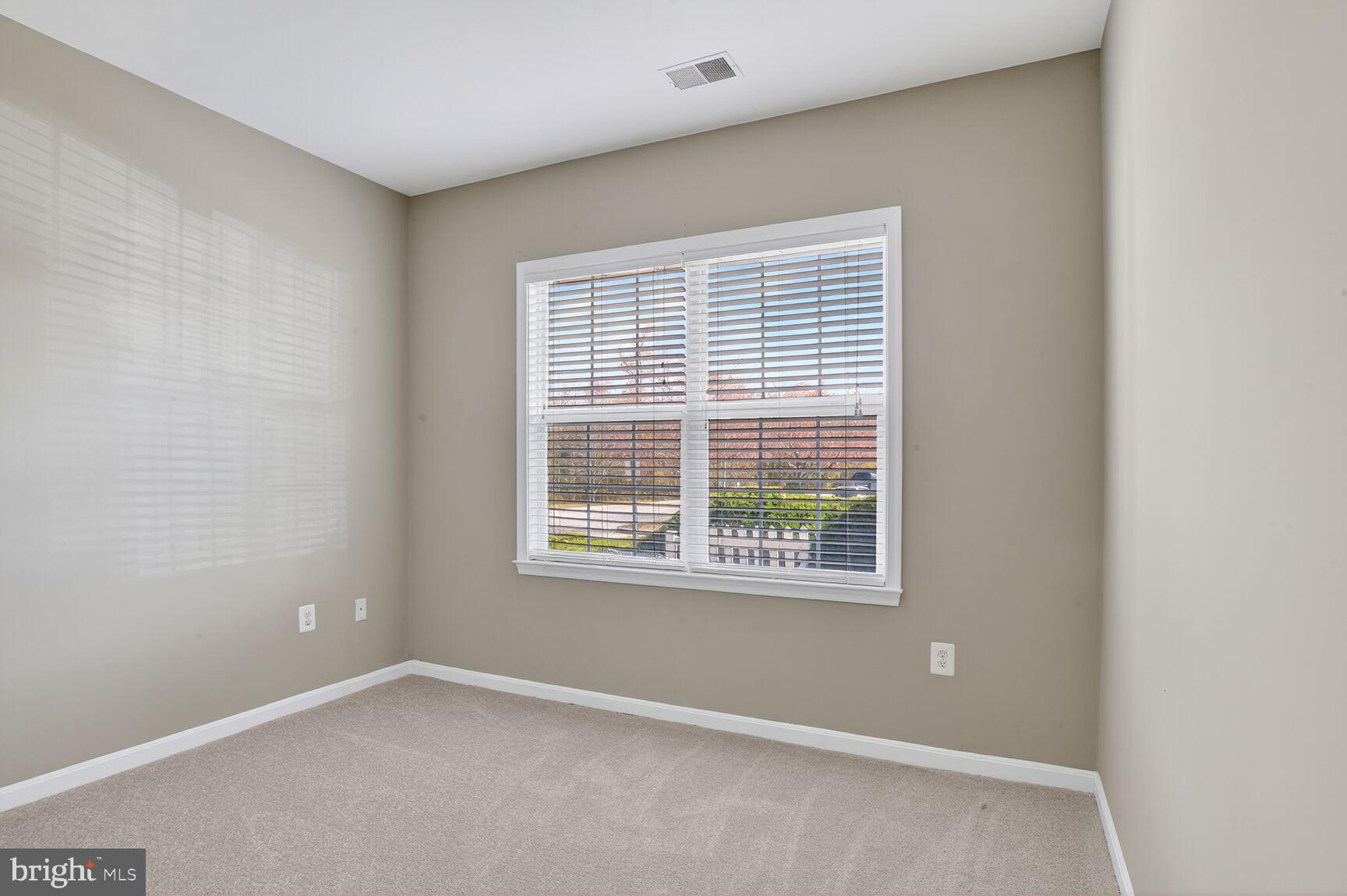 402 Aggies Circle, Unit 402D Bel Air, MD 21014 - Photo 17 of 29 a view of an empty room with a window