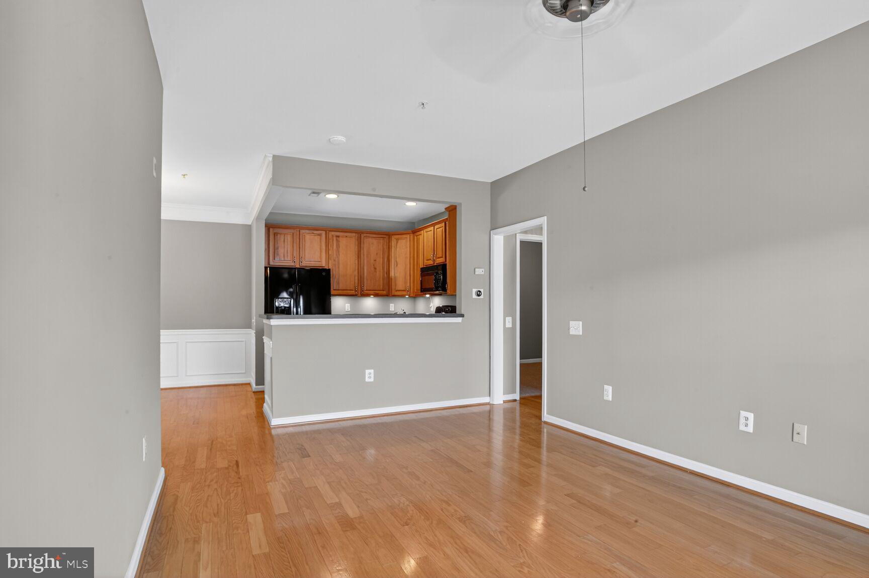 402 Aggies Circle, Unit 402D Bel Air, MD 21014 - Photo 20 of 29 a view of a kitchen with a sink and a refrigerator