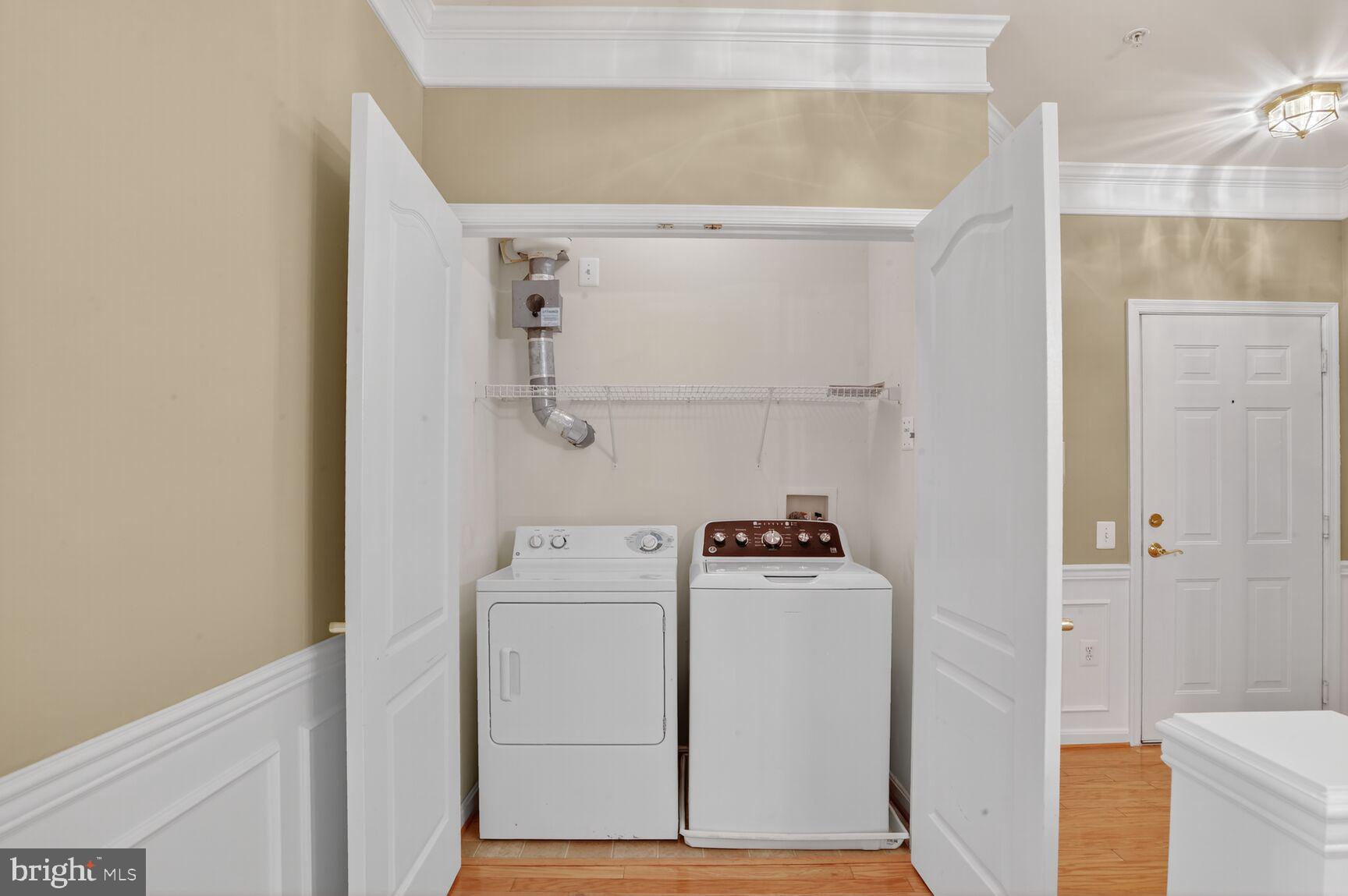 402 Aggies Circle, Unit 402D Bel Air, MD 21014 - Photo 8 of 29 a utility room with dryer and washer