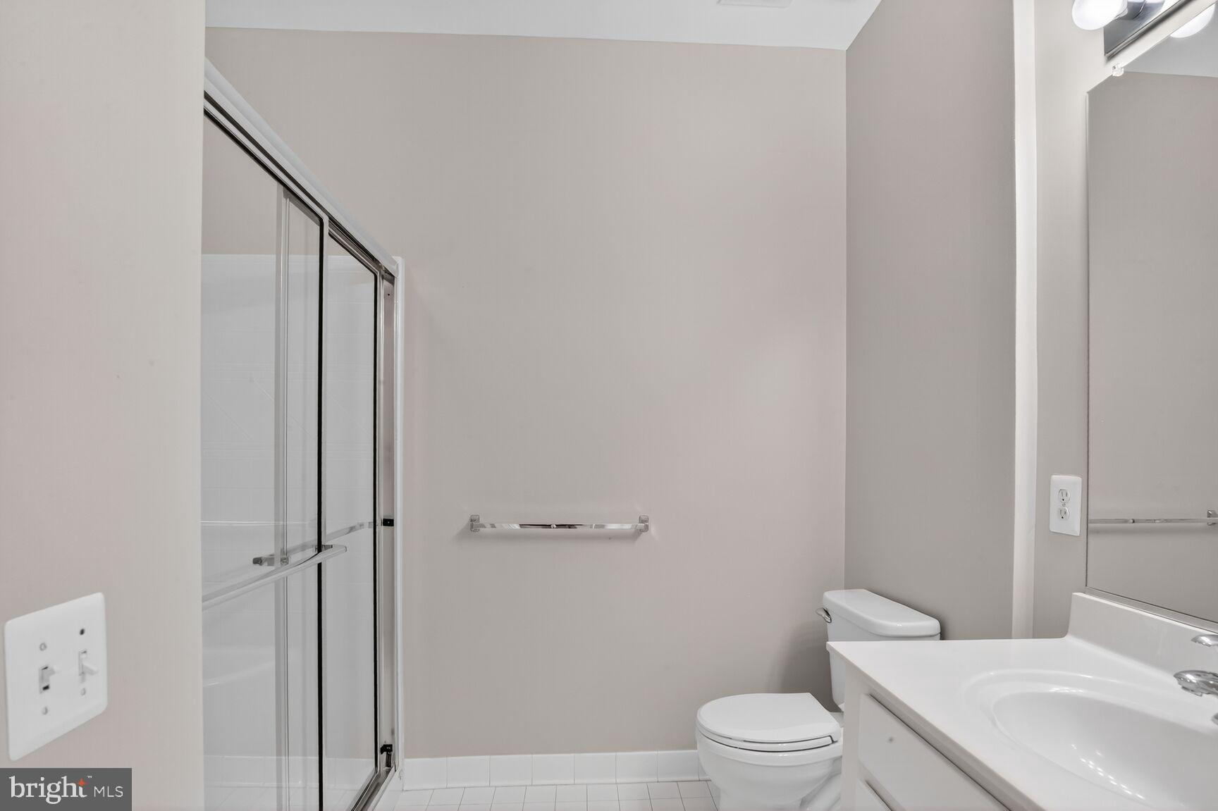 402 Aggies Circle, Unit 402D Bel Air, MD 21014 - Photo 9 of 29 a bathroom with a toilet a sink and shower